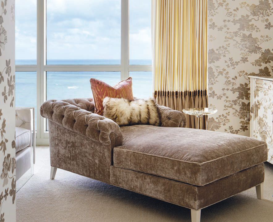 A custom tufted chaise lounge near a window in the residence’s principal bedroom. PHOTOGRAPHED BY BRANDON BARRÉ