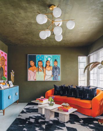London’s family portrait by Lex Marie is on display in the center, with a second portrait of London with his dogs on the adjacent wall by Kendra Dandy. PHOTO BY VENJHAMIN REYES