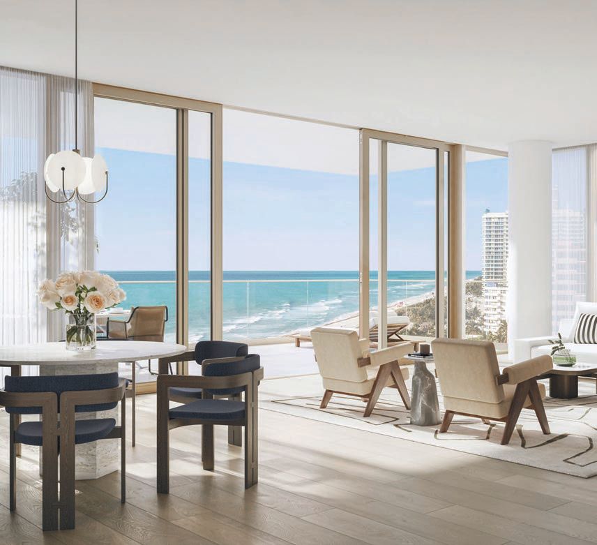 The living room evokes a chic-neutral design palette by Tara Bernerd that complements its sweeping oceanfront views.