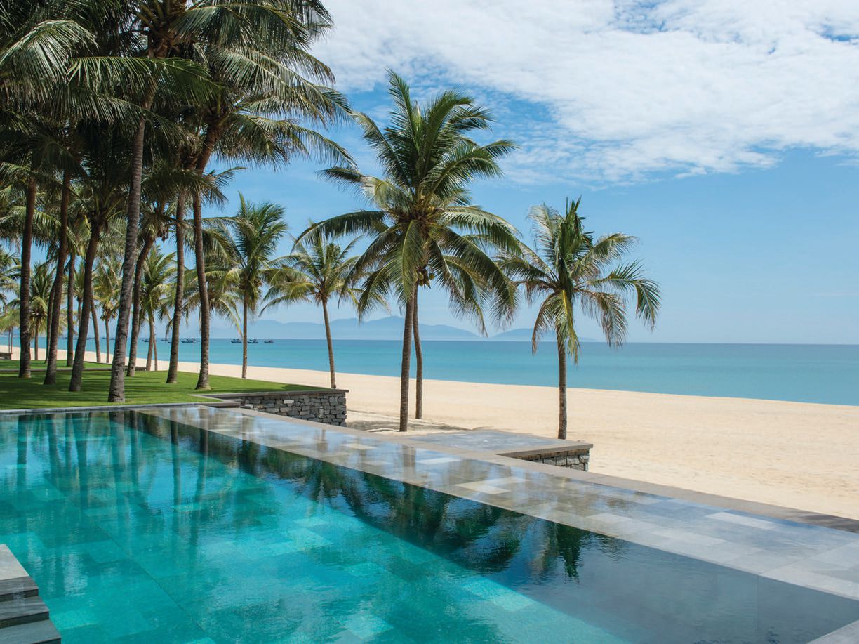 A tranquil pool overlooking 1 kilometer of pristine beach. PHOTO COURTESY OF FOUR SEASONS RESORT THE NAM HAI