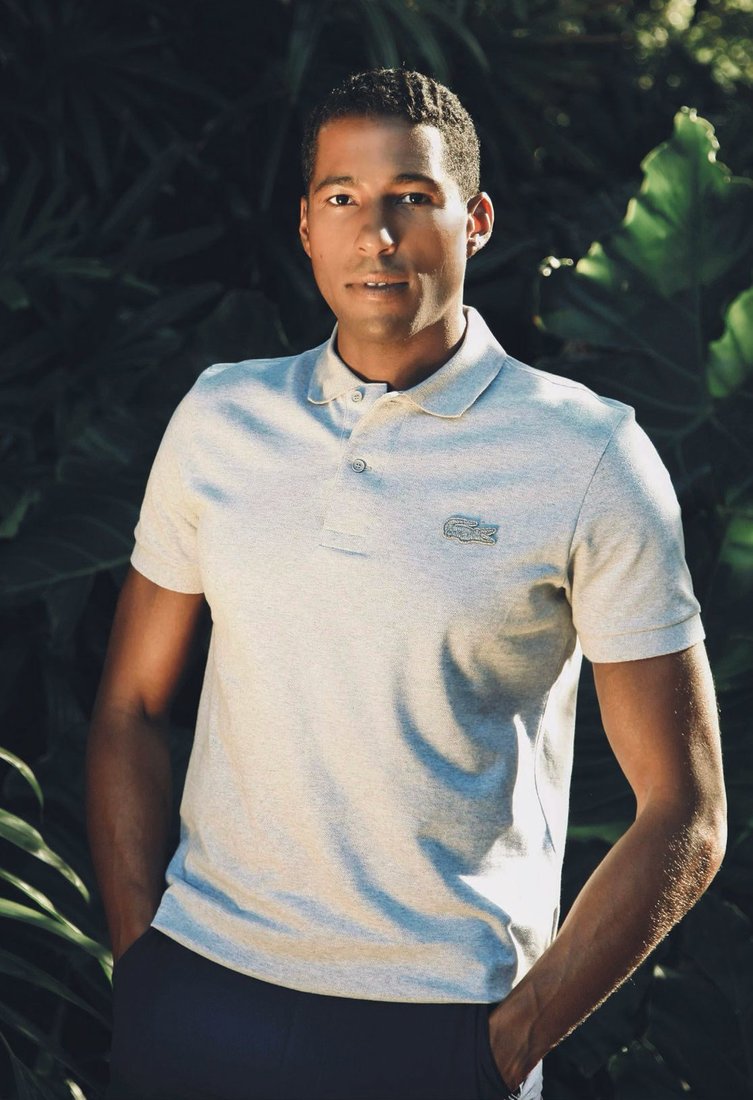 Maison de Mode co-founder Hassan Pierre wearing the new Loop polo by Lacoste PHOTO COURTESY OF MAISON DE MODE Lacoste and Maison